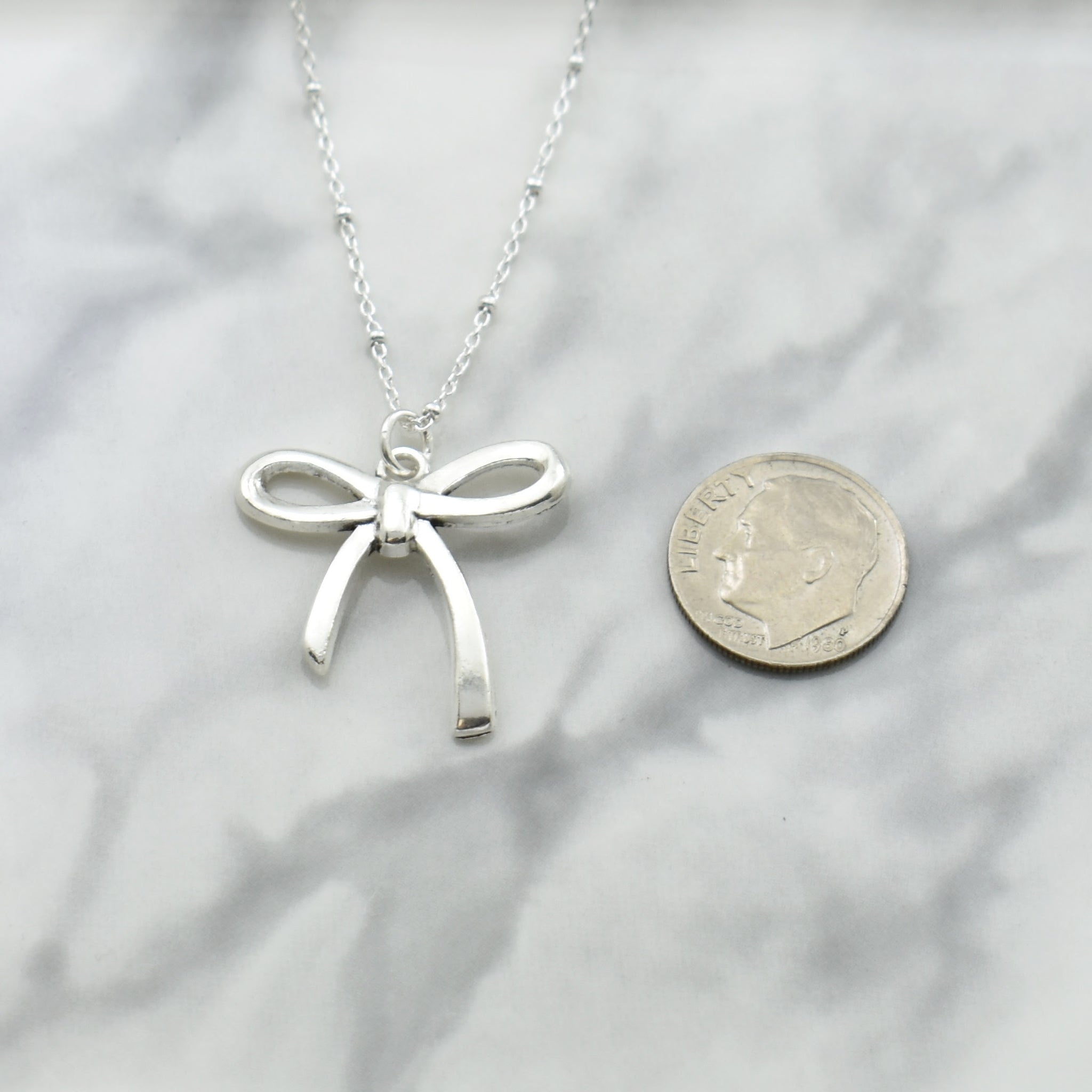 Antique Plated Coquette Bow Necklace On A Sterling Silver Saturn Chain. Bow Jewelry. Ribbon Jewelry. Coquette Jewelry.