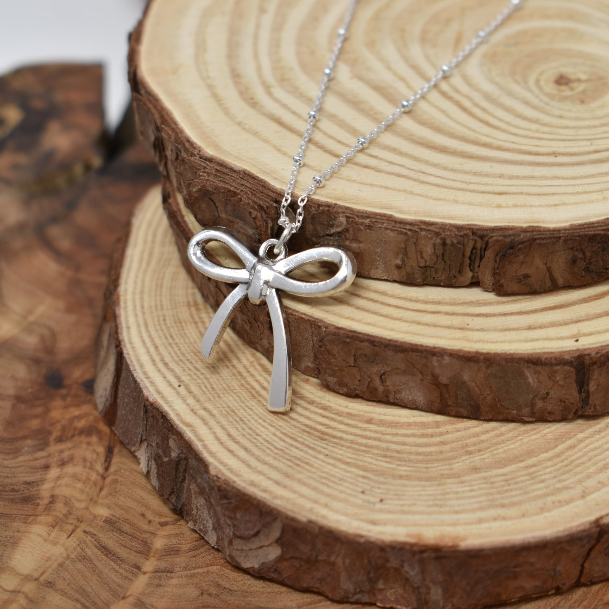 Antique Plated Coquette Bow Necklace On A Sterling Silver Saturn Chain. Bow Jewelry. Ribbon Jewelry. Coquette Jewelry.
