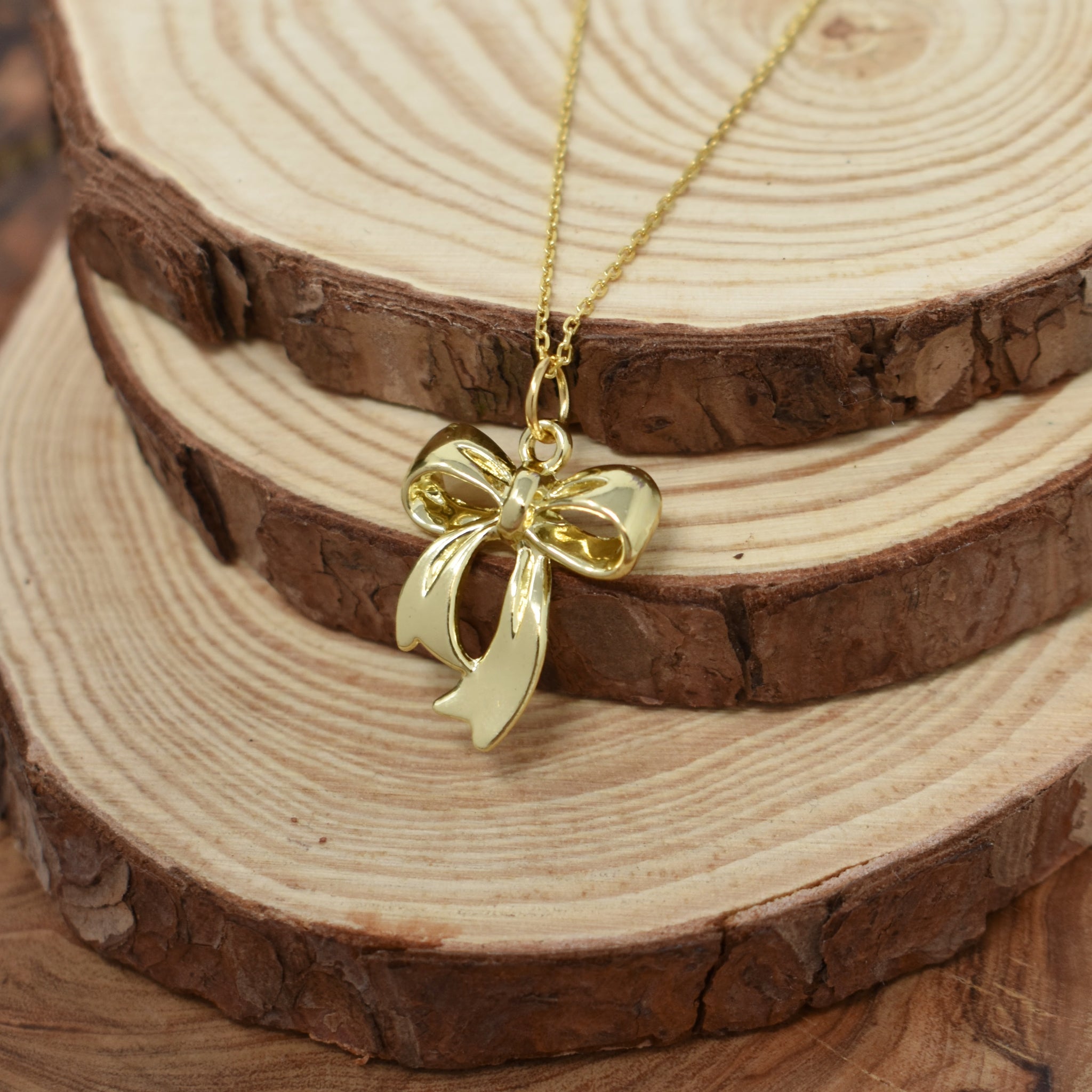 Gold Zinc Alloy Coquette Bow Necklace on a Yellow Gold Plated Sterling Silver Cable Chain. Bow Jewelry. Ribbon Jewelry. Coquette Jewelry.