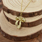 Gold Zinc Alloy Coquette Bow Necklace on a Yellow Gold Plated Sterling Silver Cable Chain. Bow Jewelry. Ribbon Jewelry. Coquette Jewelry.