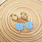 Blue or Pink Enamel Four Leaf Clovers suspended from Hoop Huggies. St. Patrick's Day Gifts. Lucky Gift. Clover Earrings. Shamrock Earrings.